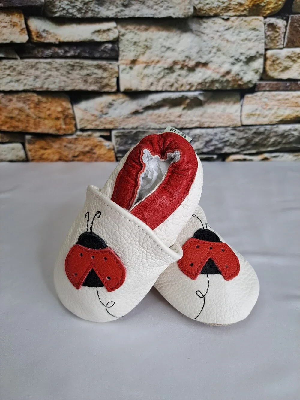 Baby White Leather Slip-On Shoes with Red Ladybug Detail